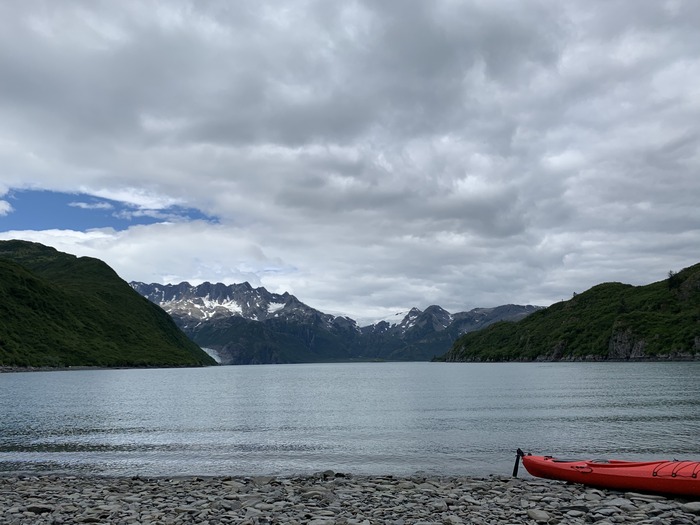 Kayak pulled up on a beach in Aialik Bay