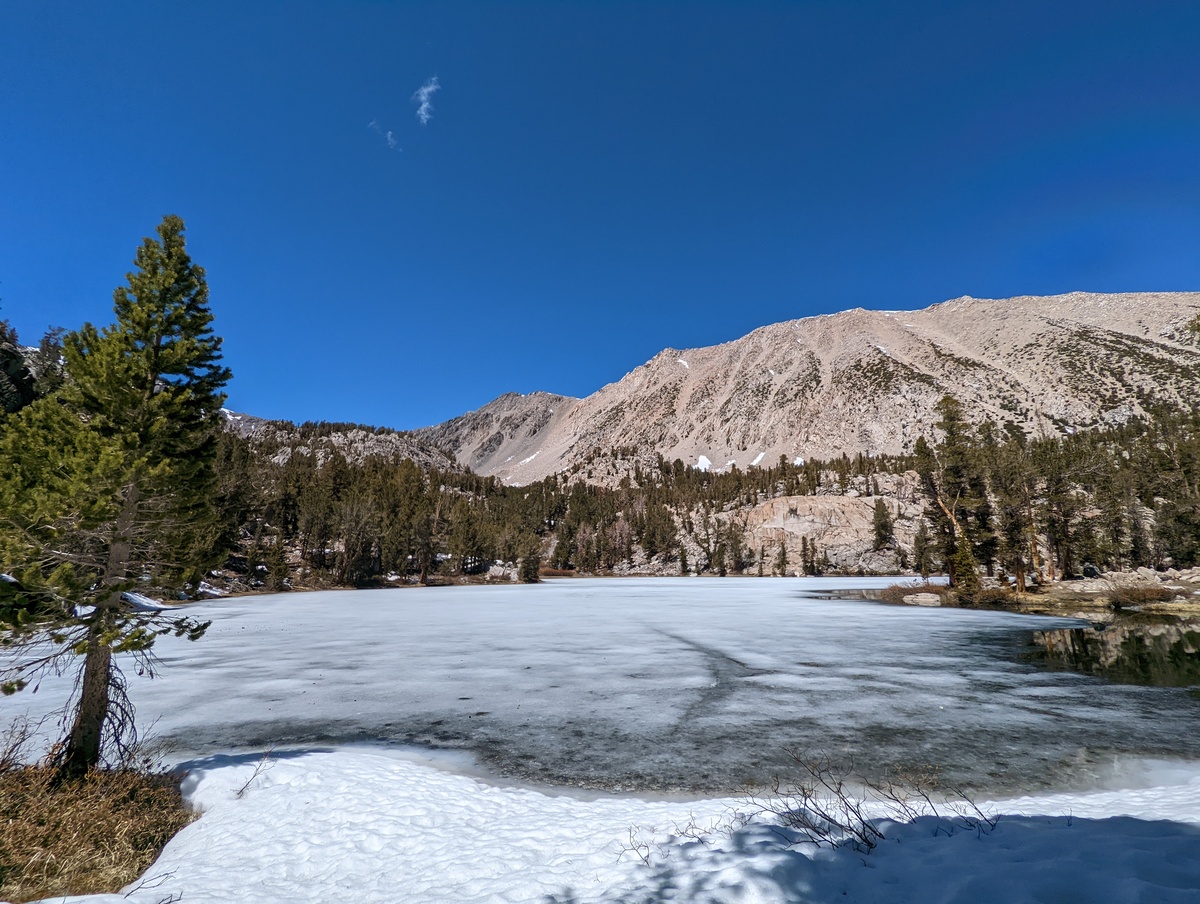 Black lake, frozen white in the picture